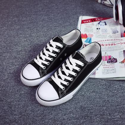 Classic Canvas Sneakers With Bold Stitching And..