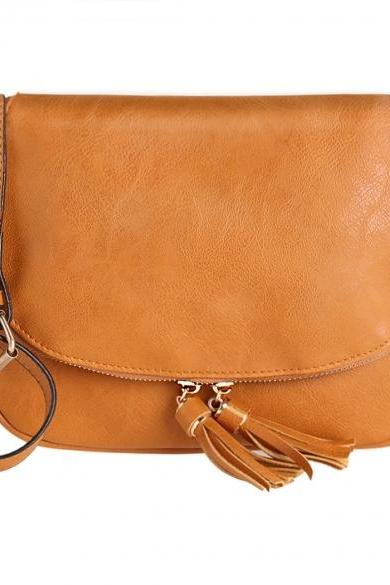 Leather Saddle Shoulder Bag Featuring Zipper and Tassel Detailing 